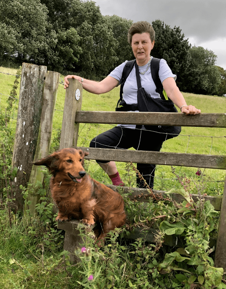 Karen crossing a stile with Tia